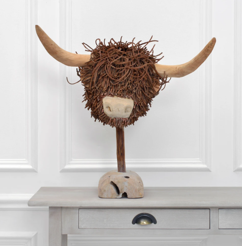 Wooden store highland cow